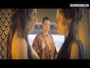 Ivana Baquero and Jaime Slater share a steamy lesbian nude scene in Spartacus: House of Ashur (2025).