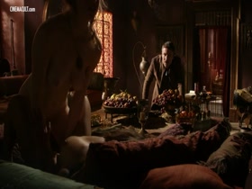 Emilia Clarke, Esme Bianco, and Sahara Knite appear nude in a revealing scene from Game of Thrones (2011-2019).