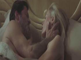 Charlize Theron and Kim Basinger share a steamy nude encounter in The Burning Plain (2008).