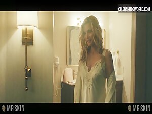 Michelle Pfeiffer teases in a sheer top with visible pokies during a seductive scene from Margo’s Got Money Troubles (2026).