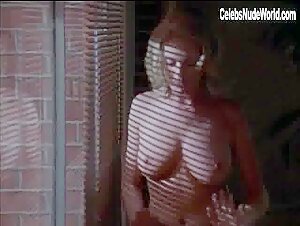 Tracy Ryan strips nude for a seductive encounter in Web of Seduction (1999).