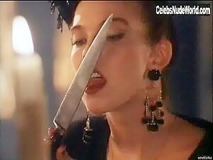 Jenna Bodnar slips into sheer lingerie for a seductive scene in the 1995 horror film Huntress: Spirit of the Night.
