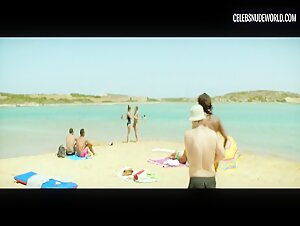 Elli Tringou and Hara Kotsali bare their breasts and natural bush in a nude scene from Suntan (2016)