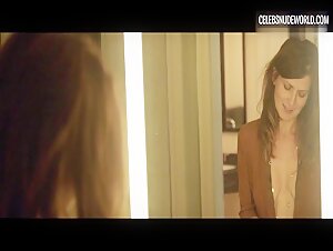 Arly Jover teases her perfect cleavage in a seductive mirror scene from Axolotl Overkill (2017)