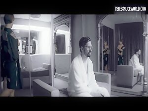 Alexia Rasmussen shows her breasts while sitting nude in a chair in Creative Control (2016)