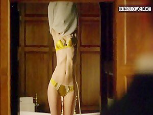 Elizabeth Debicki seductively undresses down to her lingerie in a steamy scene from The Night Manager (2016)